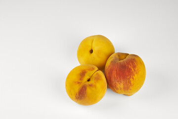 Peaches isolated in close-up with white background and copy space