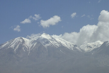 View of the imposing Chachani volcano, with its snow-capped summit in the city of Arequipa, Peru