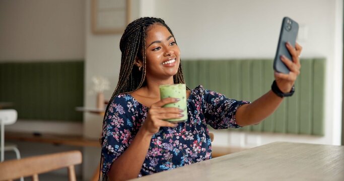 Happy, woman and selfie with matcha in cafe for social media post, wellness blog and online memory. Influencer, African girl and photography with organic tea in restaurant for profile picture update