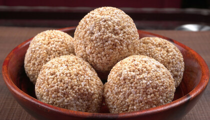 Amarnath seed, Cholai or Rajgira laddo, Also in cube shape called chikki or cake form, Indian sweet and healthy food served in a plate and bowl. Selective focus.