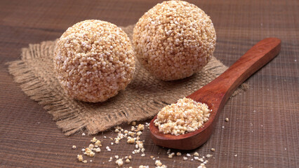 Amarnath seed, Cholai or Rajgira laddo, Also in cube shape called chikki or cake form, Indian sweet and healthy food served in a plate and bowl. Selective focus.