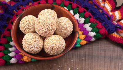 Amarnath seed, Cholai or Rajgira laddo, Also in cube shape called chikki or cake form, Indian sweet and healthy food served in a plate and bowl. Selective focus.
