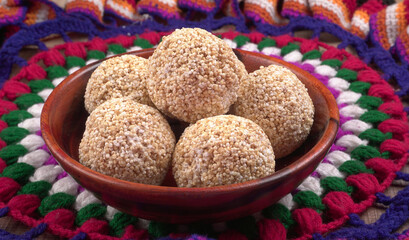 Amarnath seed, Cholai or Rajgira laddo, Also in cube shape called chikki or cake form, Indian sweet and healthy food served in a plate and bowl. Selective focus.