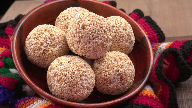 Amarnath seed, Cholai or Rajgira laddo, Also in cube shape called chikki or cake form, Indian sweet and healthy food served in a plate and bowl. Selective focus.