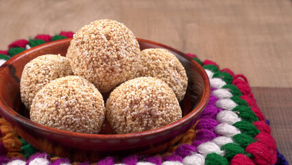Amarnath seed, Cholai or Rajgira laddo, Also in cube shape called chikki or cake form, Indian sweet and healthy food served in a plate and bowl. Selective focus.