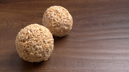 Amarnath seed, Cholai or Rajgira laddo, Also in cube shape called chikki or cake form, Indian sweet and healthy food served in a plate and bowl. Selective focus.