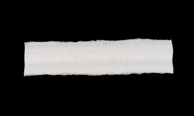 Textured white strip on black background, highlighting simplicity and contrast.