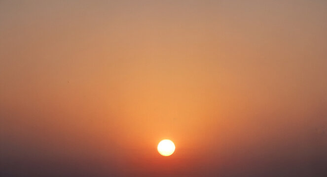 Minimal sun on the horizon, with a warm gradient from ochre to peach.