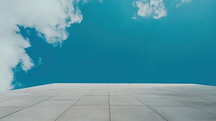 Tiled surface against vibrant blue sky with clouds