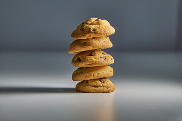 Chocolate chip cookies, isolated close-up on a gray background with copy space