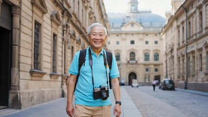 A smiling elderly asian man with backpack and camera walks confidently through a sun‑lit european alley. Concept of active retirement and cross‑cultural discovery