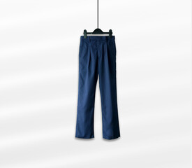 A pair of smart navy blue full-length formal pants, a standard and essential component of a respectable school uniform.