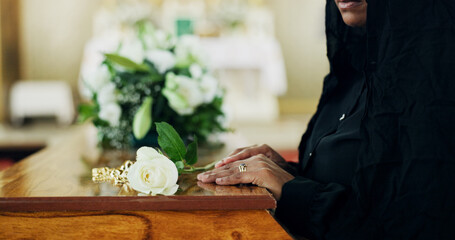 Hands, woman and coffin with rose at funeral for farewell, mourning death and goodbye at burial...