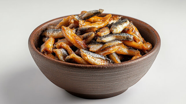 Bowl of boiled whitebait shown on a white backdrop