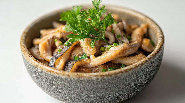 Bowl of boiled whitebait shown on a white backdrop