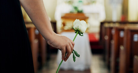 Funeral, hand or person with flower in chapel for farewell service, mourning death and respect....