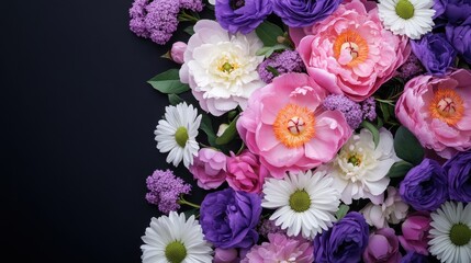 A beautiful bouquet of purple and pink flowers with delicate white blossoms on a dark background.