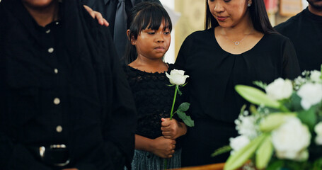 Loss, death or child with flower in funeral farewell service, mourning person or grief. Coffin,...