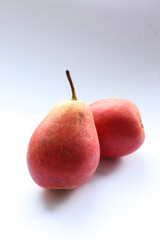 Ripe red pear on a white background, closeup of photo