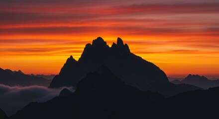 Majestic sunset paints the mountain peaks fiery orange breathtaking view nature beauty