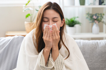 Woman measuring temperature her body on the bed. person got fever lying on the bed.