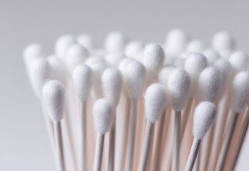 Cotton swabs arranged in a neat cluster on a white background for versatile, everyday uses in hygiene and cleaning tasks