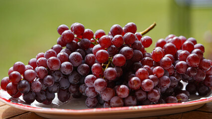 Close up of raw organic sweet red grapes background.