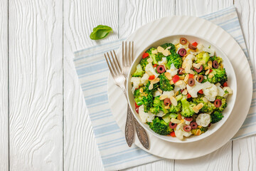 Italian Broccoli Cauliflower Salad in a white bowl