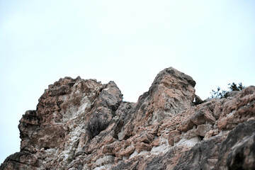 Majestic rocky cliff against a bright sky