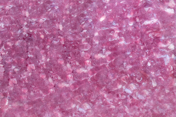 Lean minced beef sealed in a vacuum packed plastic wrap. Fresh meat in packaging background concept.