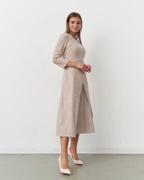 Elegant model showcases contemporary fashion in a studio setting