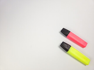Two Colorful Highlighters Isolated on a White Background with Copy Space