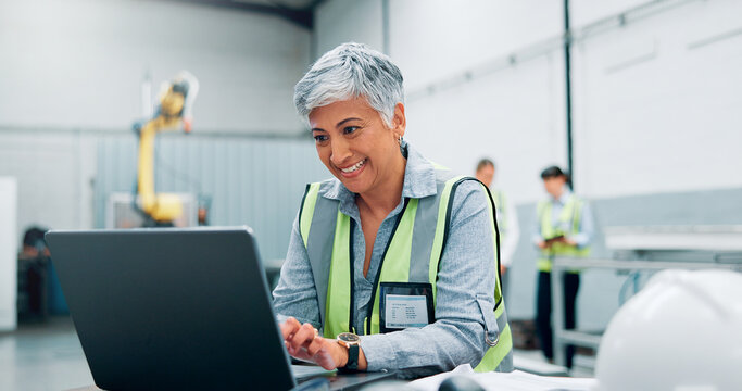 Laptop, robotics and smile with woman in workshop for automation, manufacturing or production. Computer, design and engineering process with happy mature employee in factory for tech development