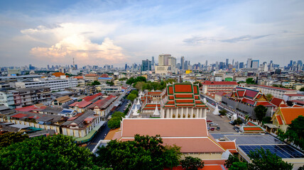 Elevated temple view with cloudy sky and urban spread