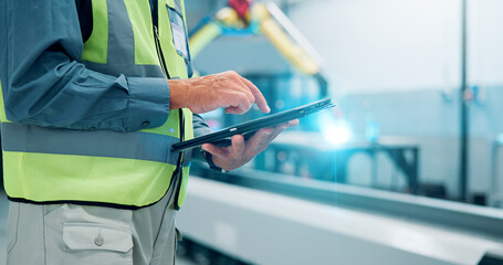 Hands, man and tablet at robotics factory for research, machine update and technical guide. Male...