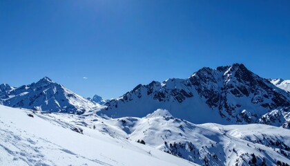 Snowy mountain adventure alpine region landscape photography bright blue sky wide angle view exploring nature's beauty