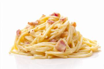 Creamy pasta dish with crispy bacon served on a clean white plate in a bright kitchen setting