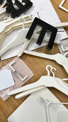 volumetric letters and hangers are scattered on the floor