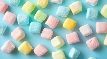 Closeup square colorful pastel marshmallow set on vibrant blue background.