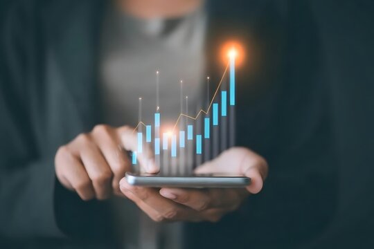 A businessperson analyzing Stock Market Data on Smartphone with Digital Candlestick Chart Visualization. - Powered by Adobe
