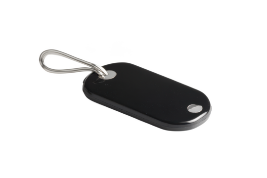 A black plastic tag with a metal loop and silver rivets on a black isolated background