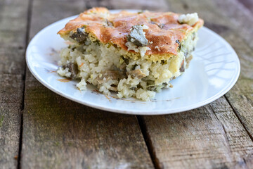   Rice shepherd's pie.   Rice and  Lamb meat  Casserole  with   parmesan cheese and garlic on wooden rustic bakcgound. 