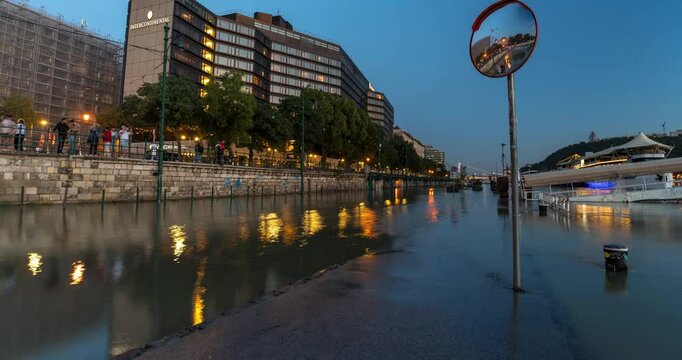 Budapest, Hungary - September 23, 2024: Storm Boris Aftermath: Flooded Road Near InterContinental Hotel Draws Onlookers in Budapest. Timelapse, slide transition.