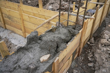 Pouring rubble concrete into the foundation