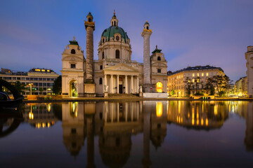 Vienna, Austria. View of St. Charles's Church (Karlskirche) reflecting in water at dusk