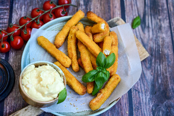 Crispy  deep fried home made    chicken strips Breaded  with  almond flour chicken  breast fillets  with chilly peppers and fresh   basil on wooden rustic background. Ketogenic diet food