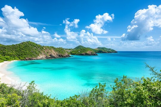 Tropical beach with turquoise waters and lush green hills under a blue sky
