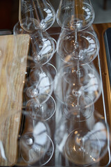 Clean wine glasses are on the table of a special wine cabinet, stylish table setting, ice, bottle...