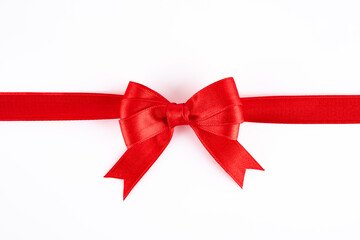 Red ribbon and bow on white background