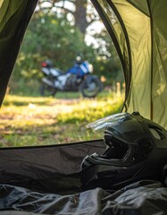 Close-up of motorcycle helmet inside tent with view of bike outside